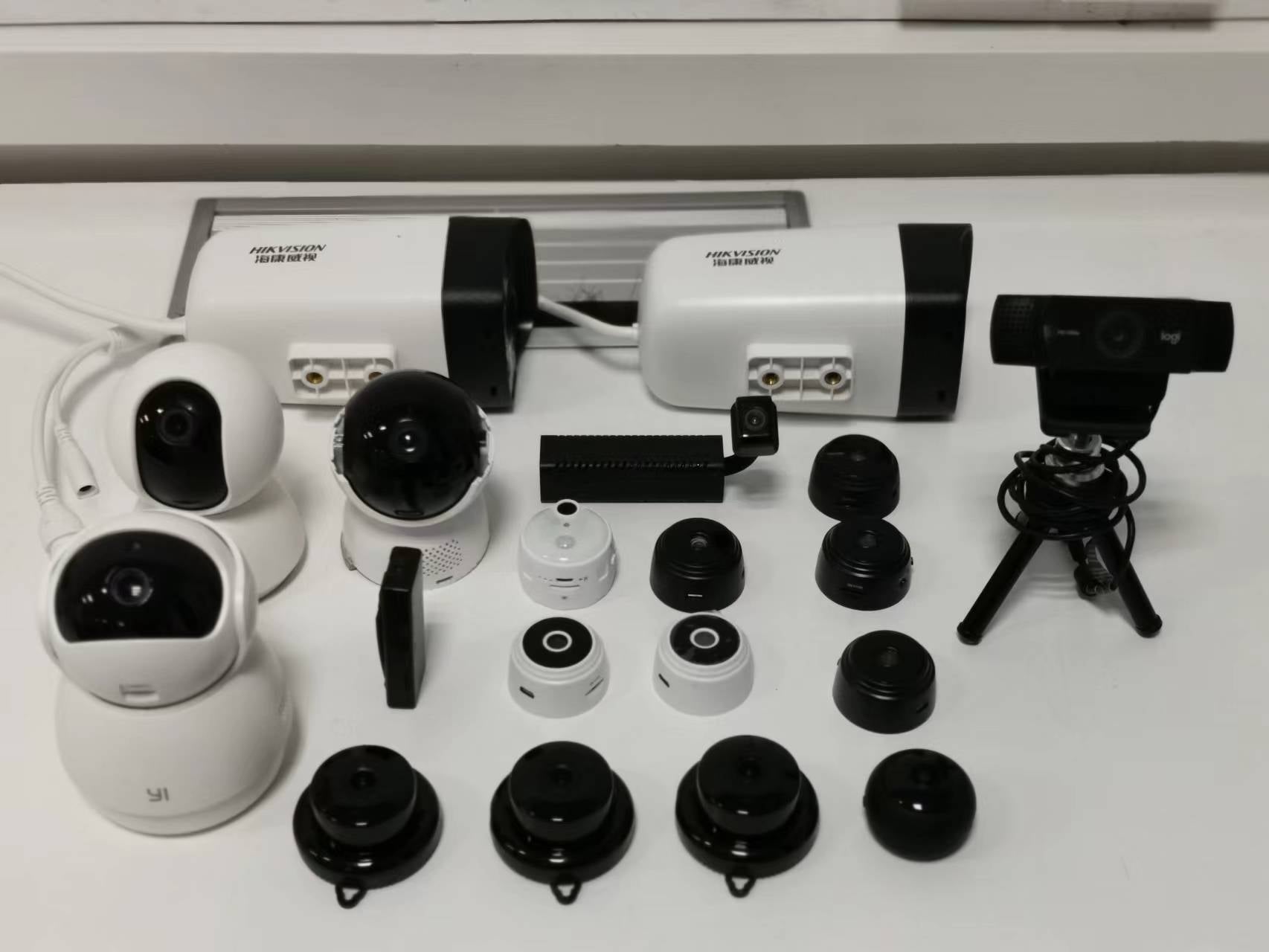 Some of the 50 consumer cameras used in the ESauron experiments, including miniature spy cameras, webcams and home security cameras. Image: Zhang et al., USENIX Security 2024